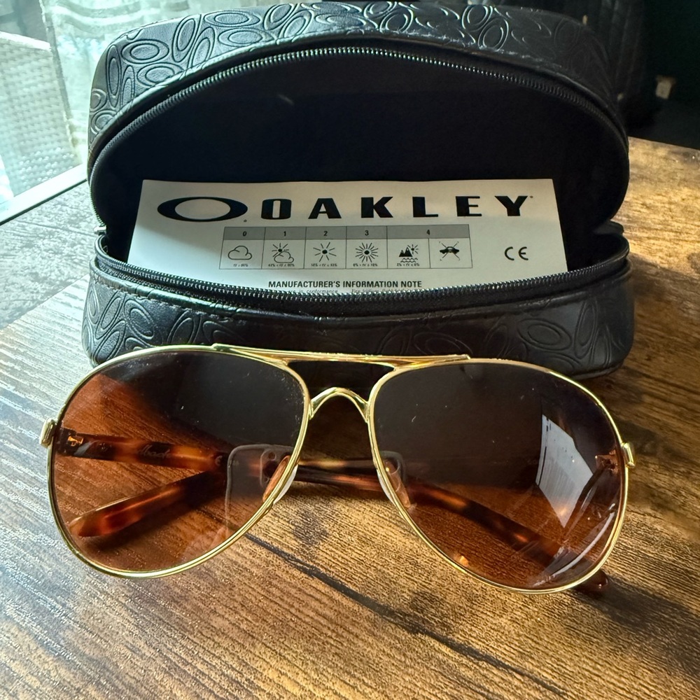 Polarized Oakley Gold Frame Sunglasses with Brown Lenses
